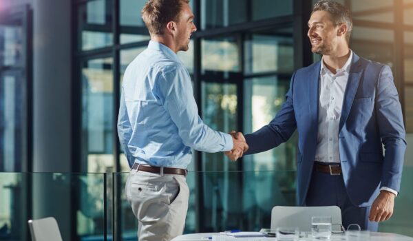 co-managed IT partnership with two people shaking hands